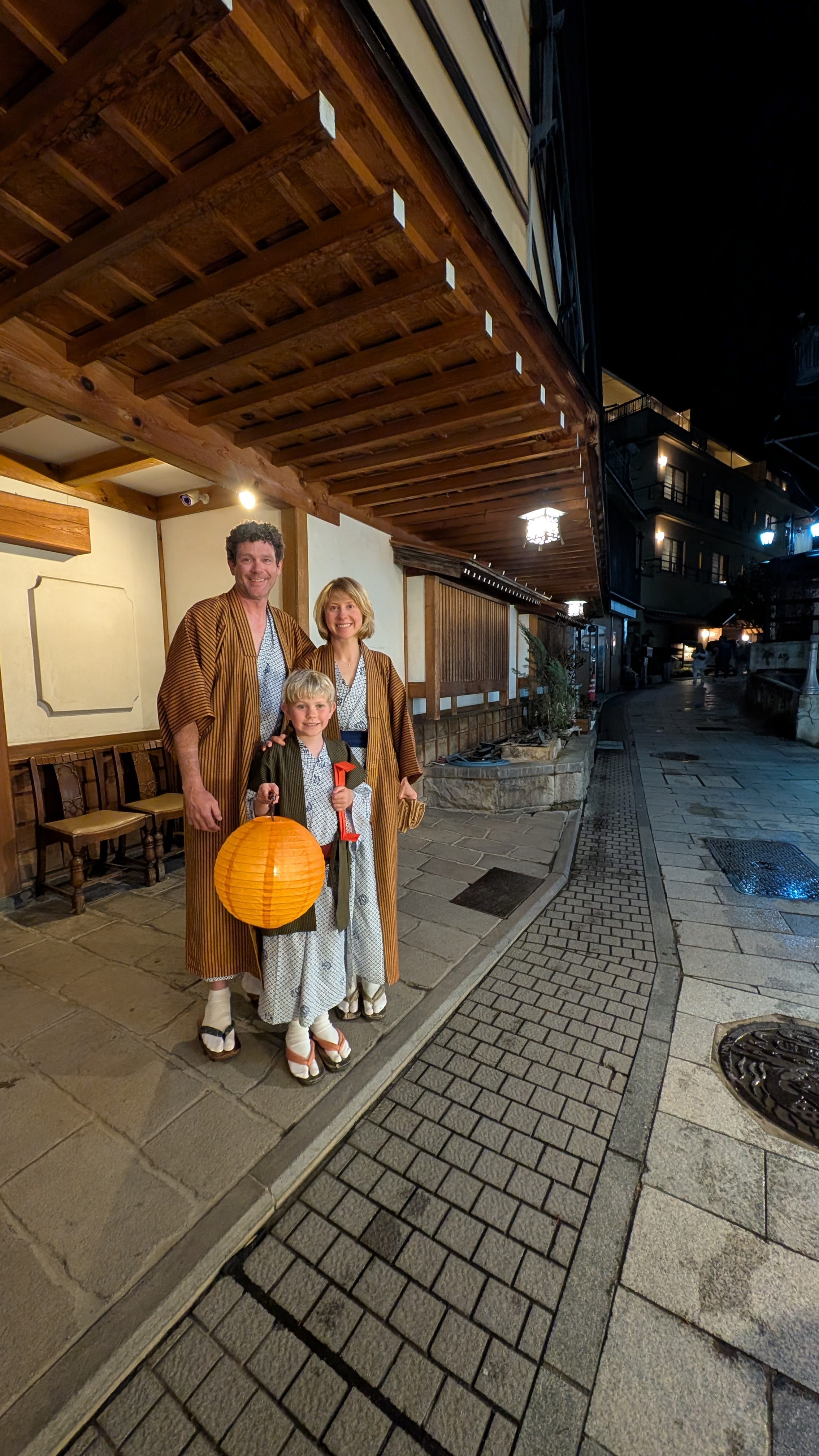 Yukata, wooden geta, and a lantern — walking the cobblestone streets of Shibu Onsen at night